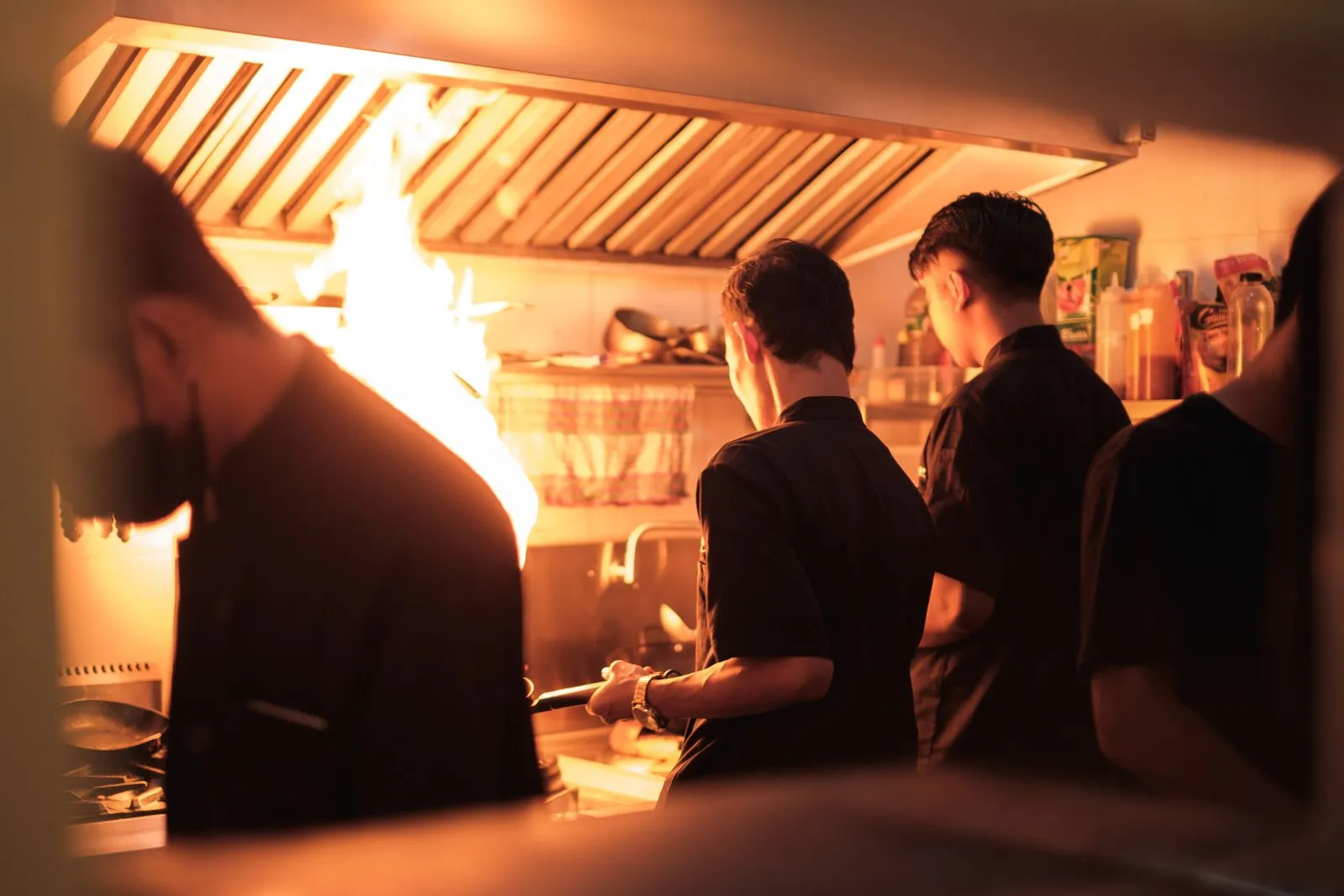 A busy restaurant kitchen on the line during service